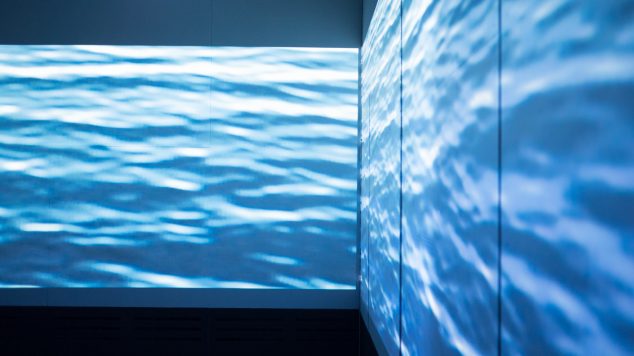 Waves projected on the wall of the 103 video projection mapping environment at IMRC Center