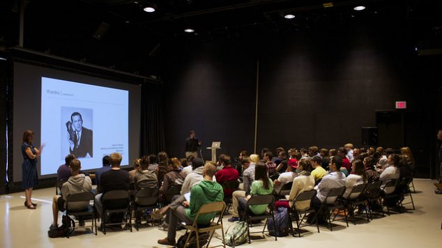 Photo of person presenting at one of the IMRC rooms