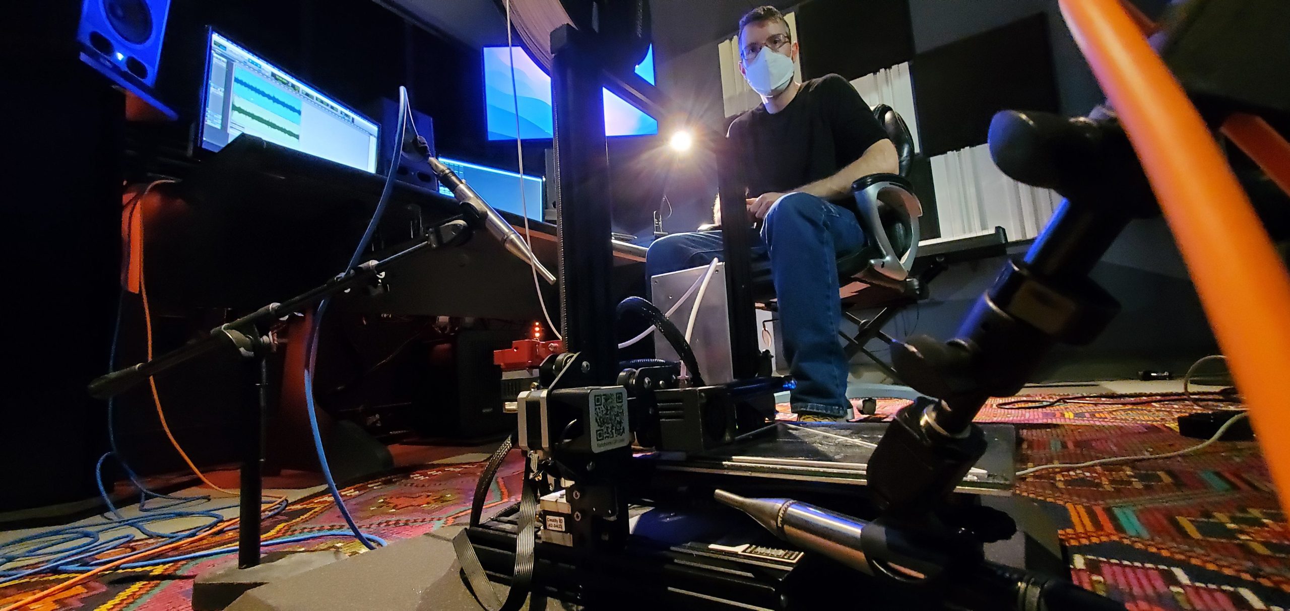 Mechanical Engineering graduate student recording custom 3D printer in the IMRC Center Recording and Production Lab