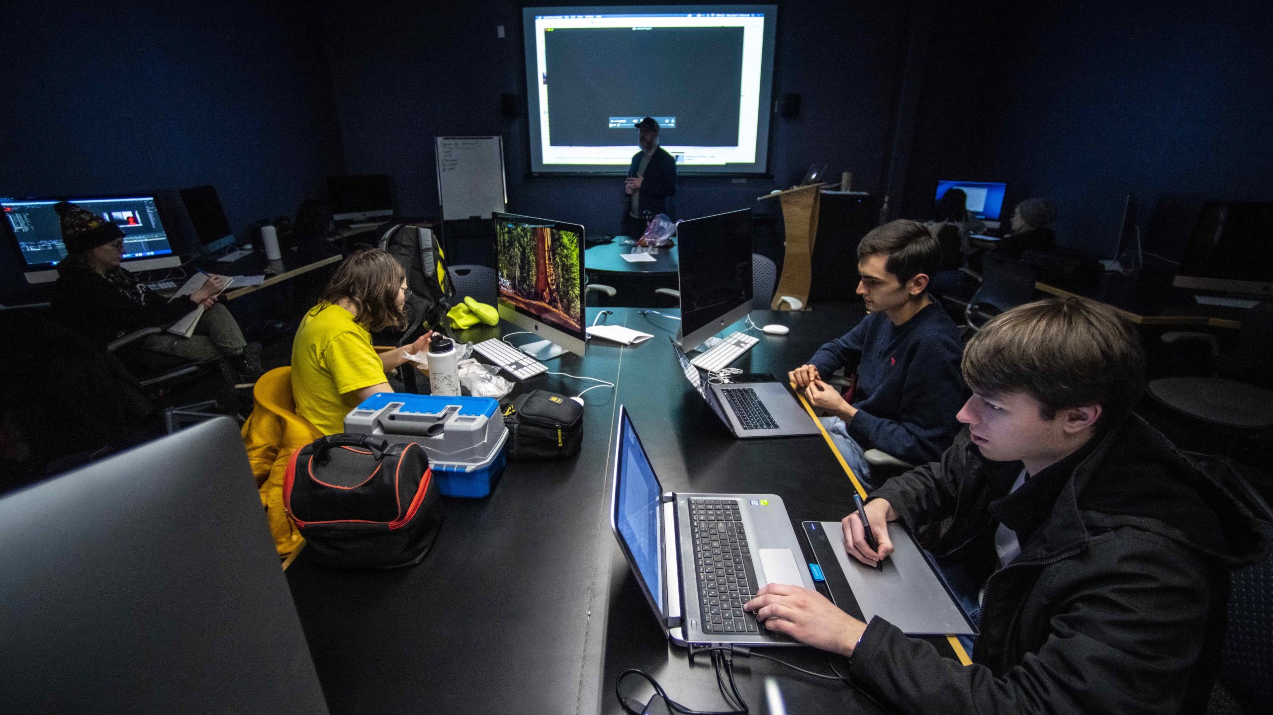 Student in class using computers in the IMRC Center computer lab