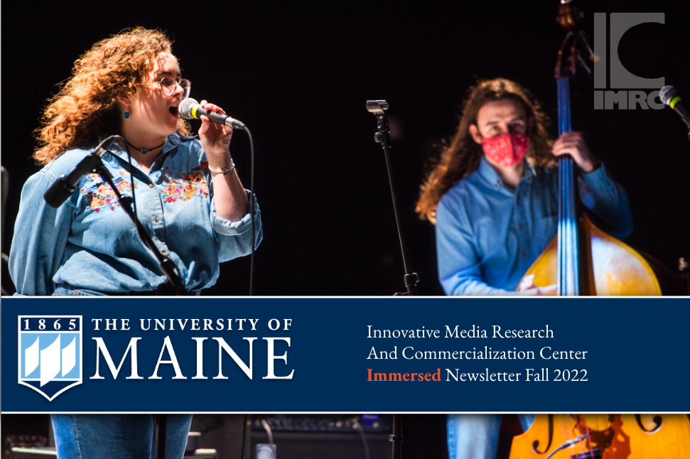 Singer on IMRC Center stage with upright bassist in the background